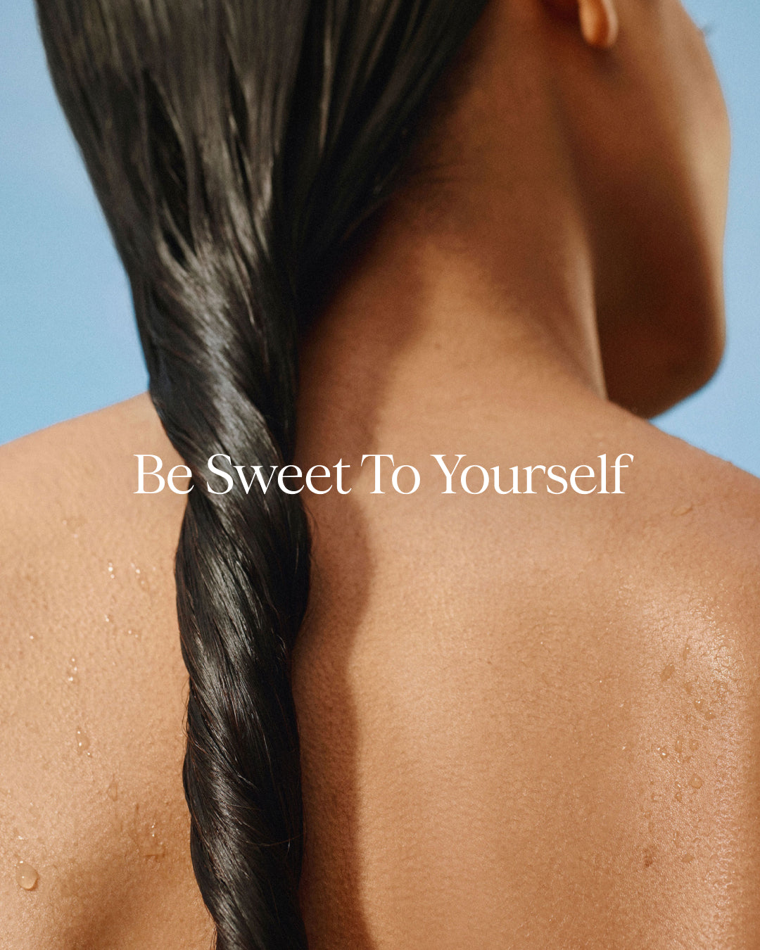 Person with a braided hairstyle against a blue sky, with 'Be Sweet To Yourself' text.