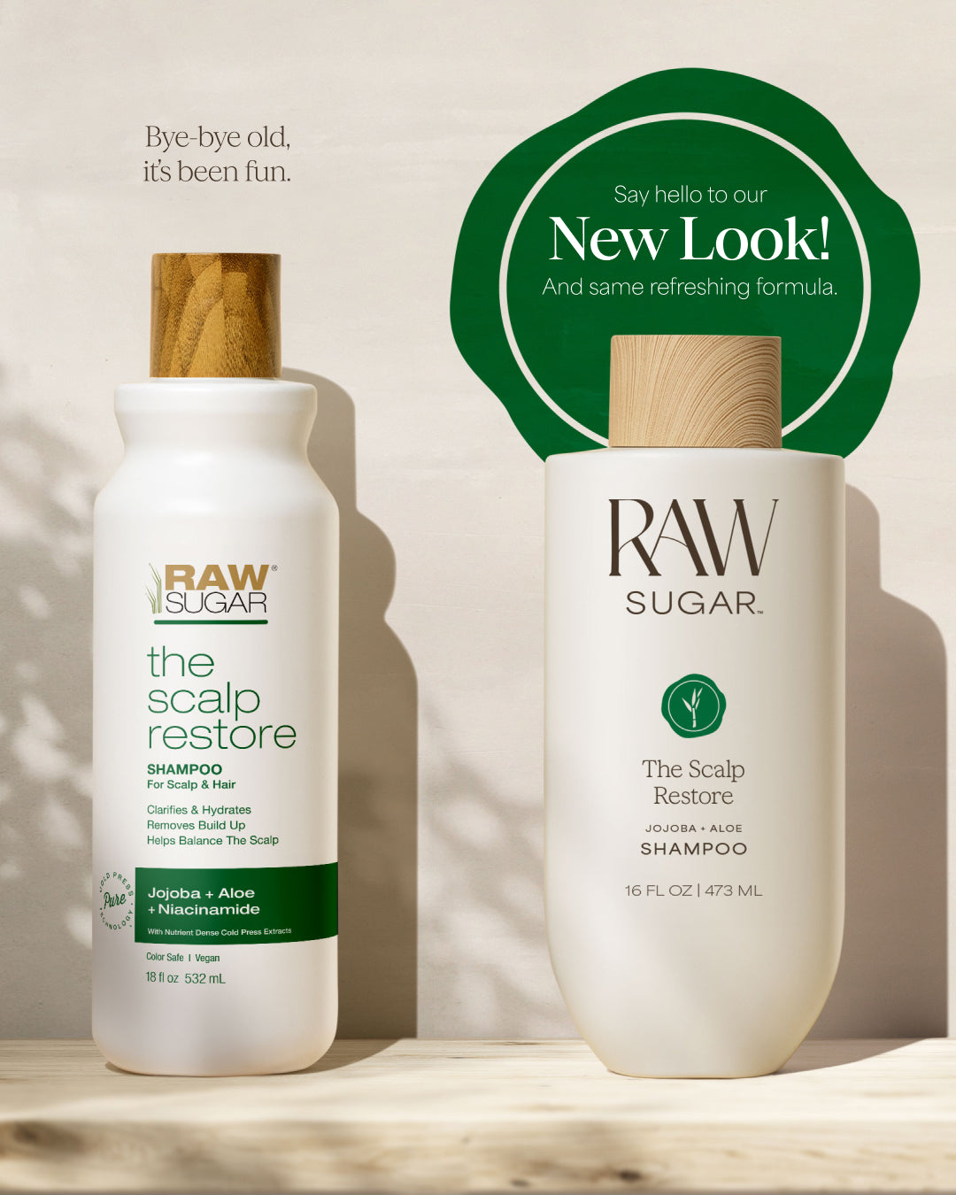 Two bottles of Raw Sugar The Scalp Restore Shampoo on a wooden surface with a beige background.