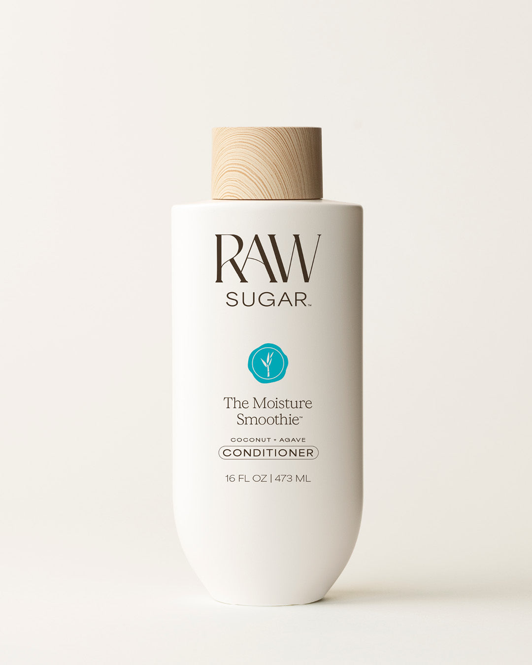 Bottle of Raw Sugar Moisture Smoothie Conditioner on a cream background, designed to moisturize hair with clean ingredients.