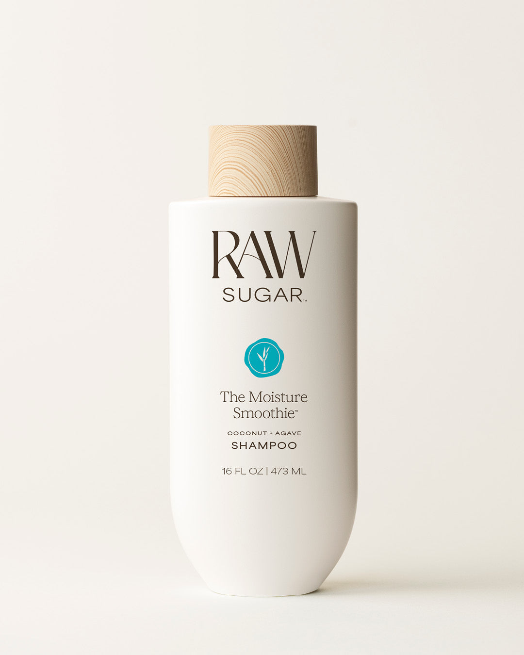 Bottle of Raw Sugar Moisture Smoothie Shampoo on a cream background, designed to help moisturize hair with clean ingredients.