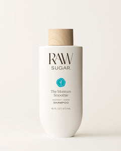 Bottle of Raw Sugar Moisture Smoothie Shampoo on a cream background, designed to help moisturize hair with clean ingredients.