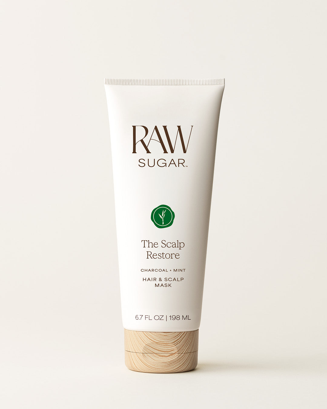 Bottle of Raw Sugar Scalp Mask on a cream background, designed to help purify scalp and hair with clean ingredients.