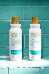 clean shampoo and conditioner sitting in shower coconut and agave