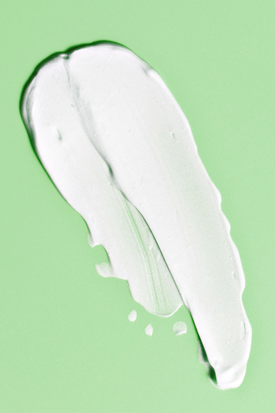 lotion smear on green background