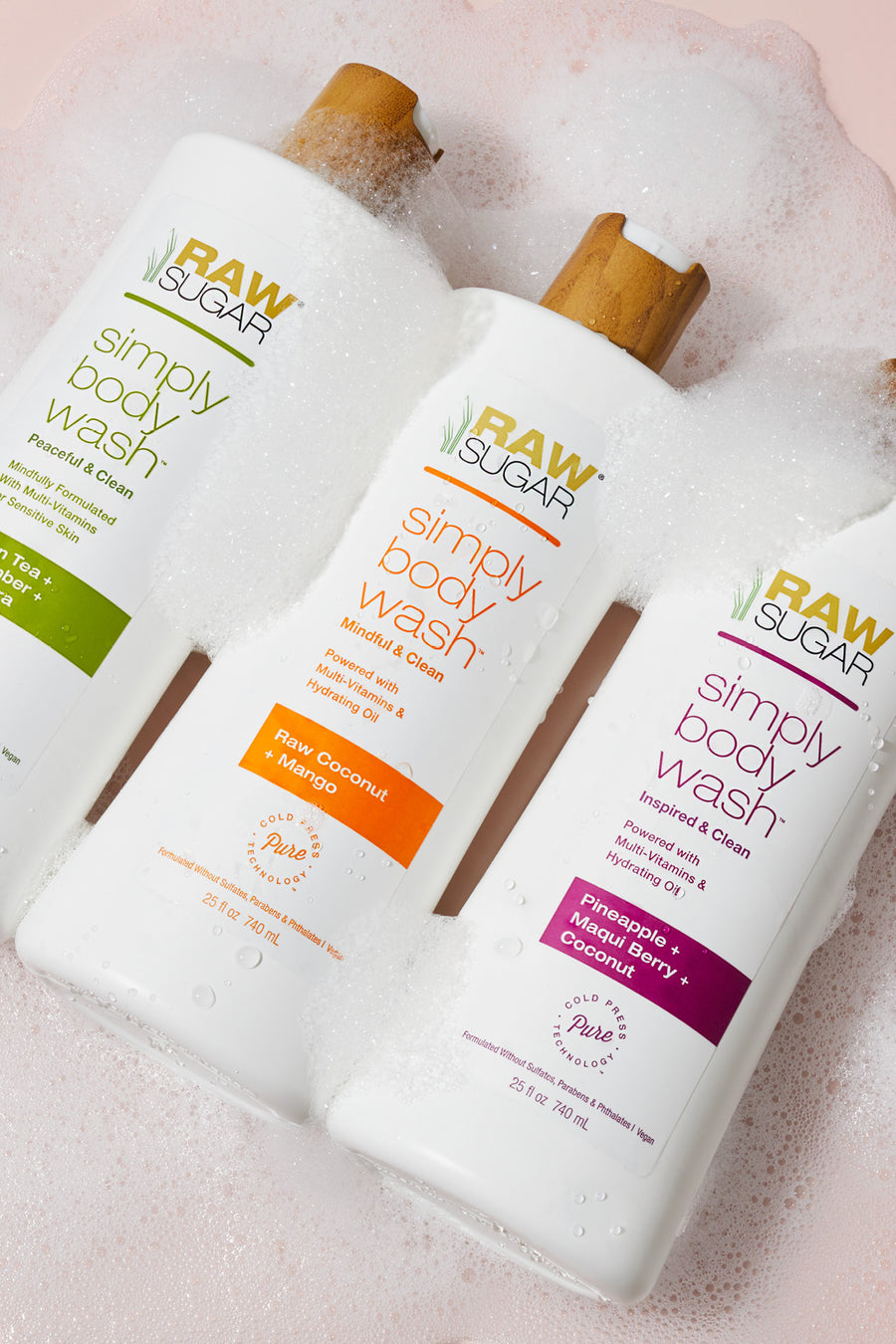three body washes laying down in suds, clean good for you ingredients