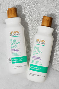 overhead shot of grow pro shampoo and conditioner in water