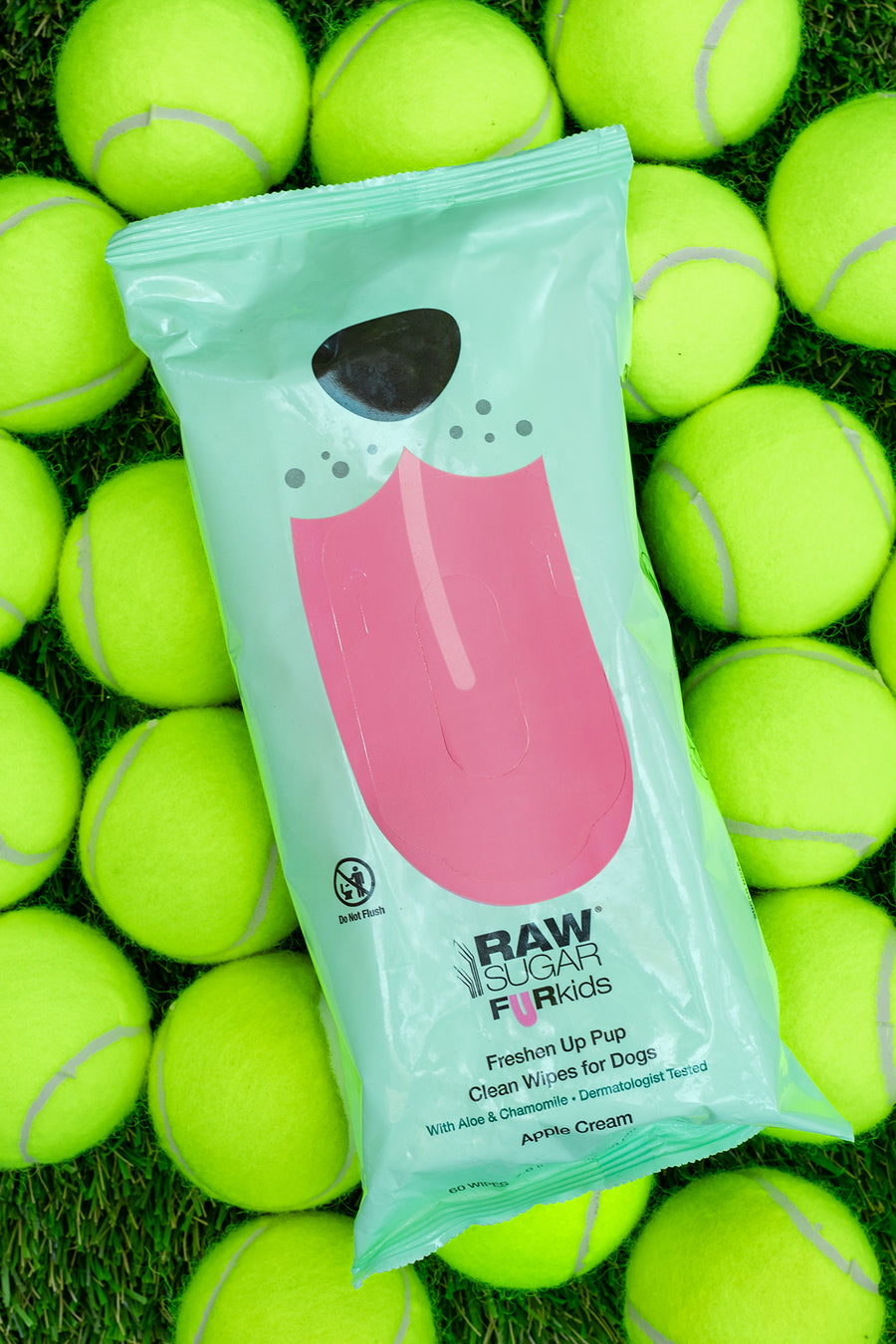 fur kids pet wipes laying on tennis balls