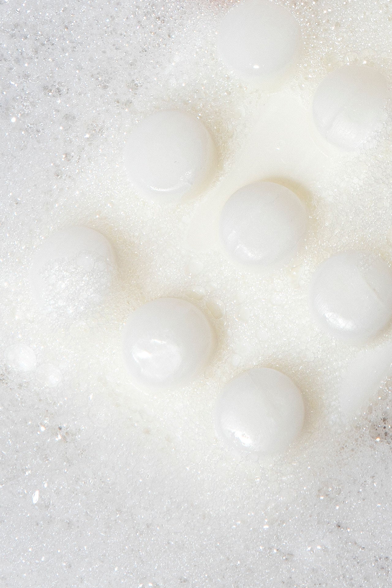 zoomed in image of bar soap covered in suds