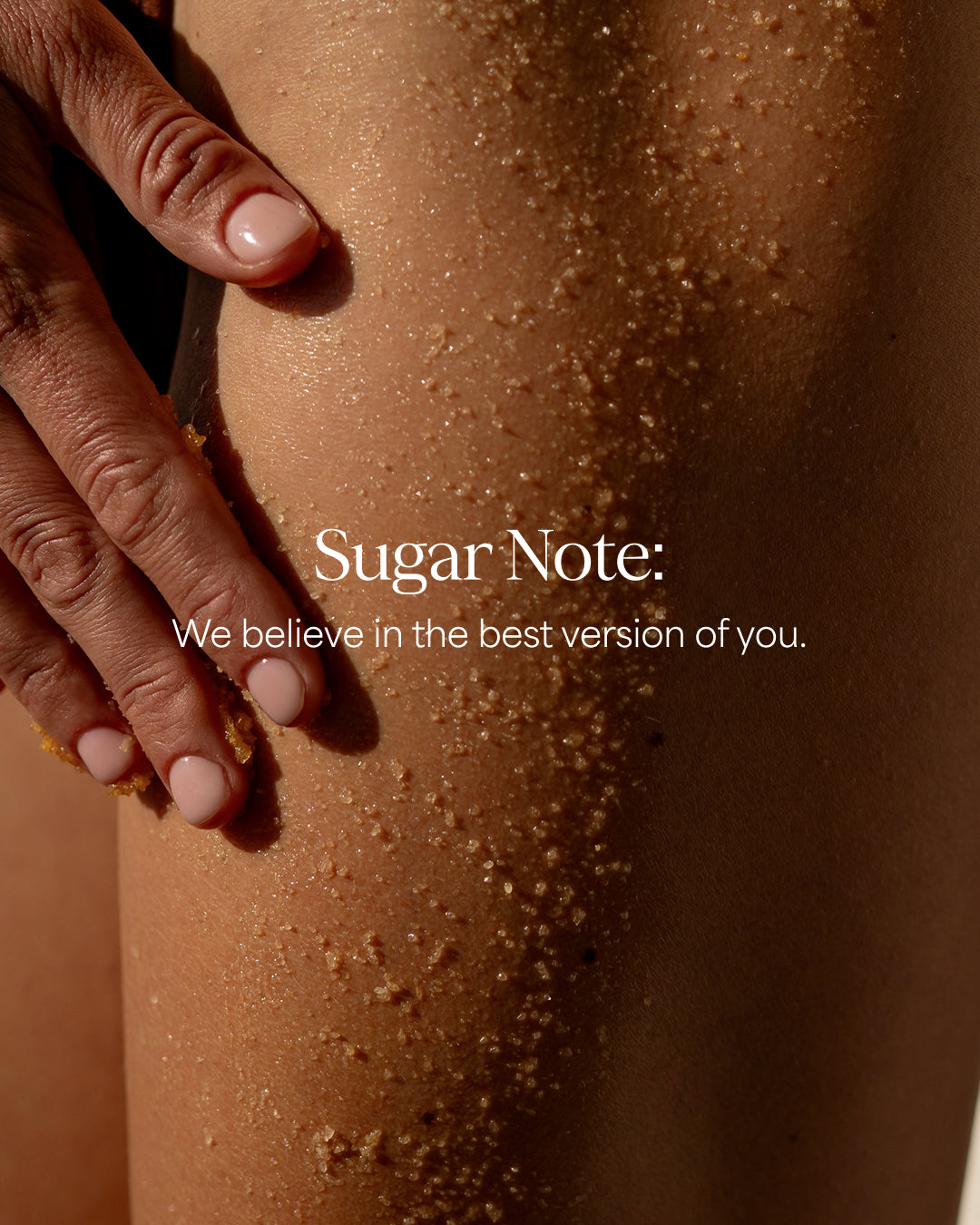 Close-up of a person's leg with sugar crystals and a hand, featuring the 'Sugar Note' brand.