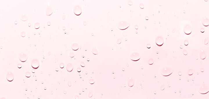 Pink Background with Water Droplets