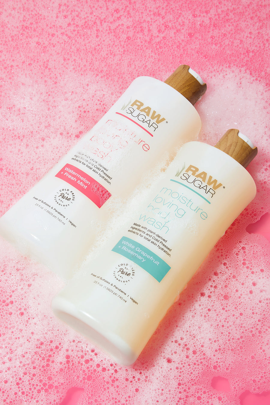 two moisture loving body washes on pink background