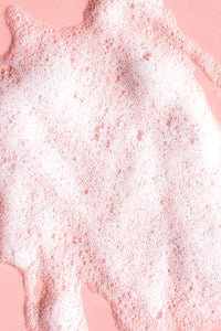Bath bubbles on pink background