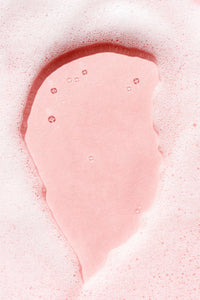 Sudsy foam on a pink background