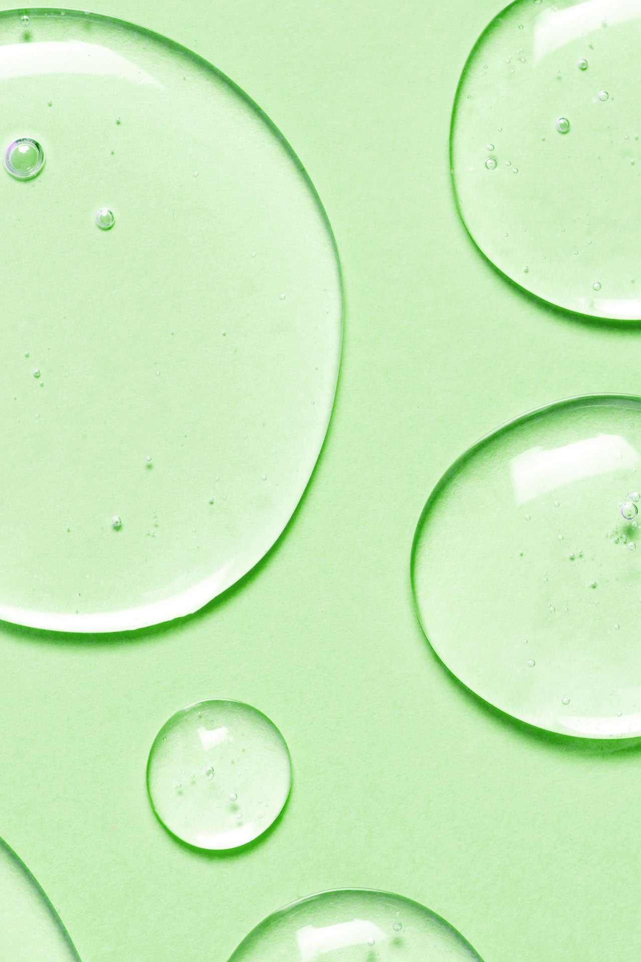 Fresh water drops on light green background