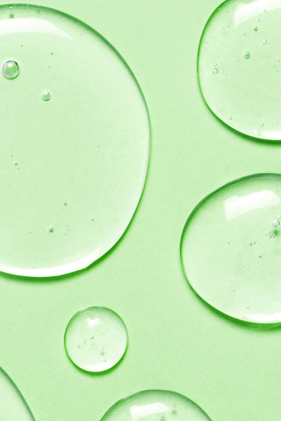 Fresh water drops on light green background