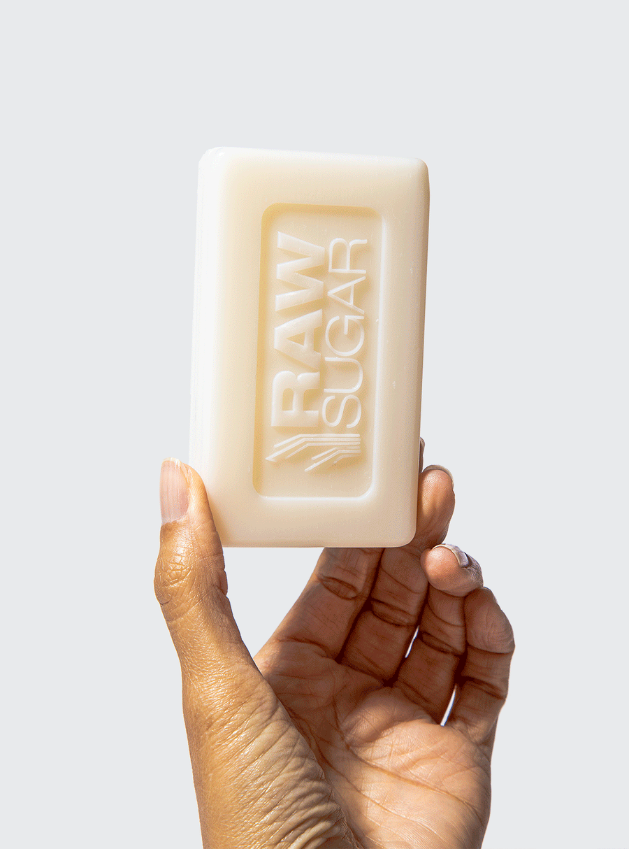 Animated hand holding one bar of soap turning it 180 degrees front to back