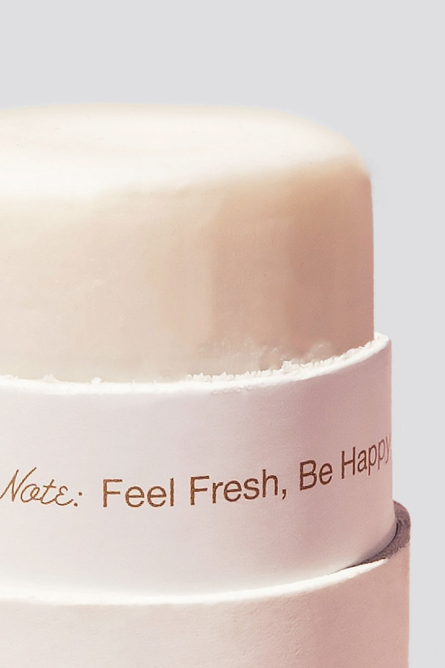 Close up of top of open deodorant sticking out of eco tube packaging