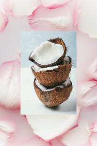 Stack of rack coconut halves and rose petals