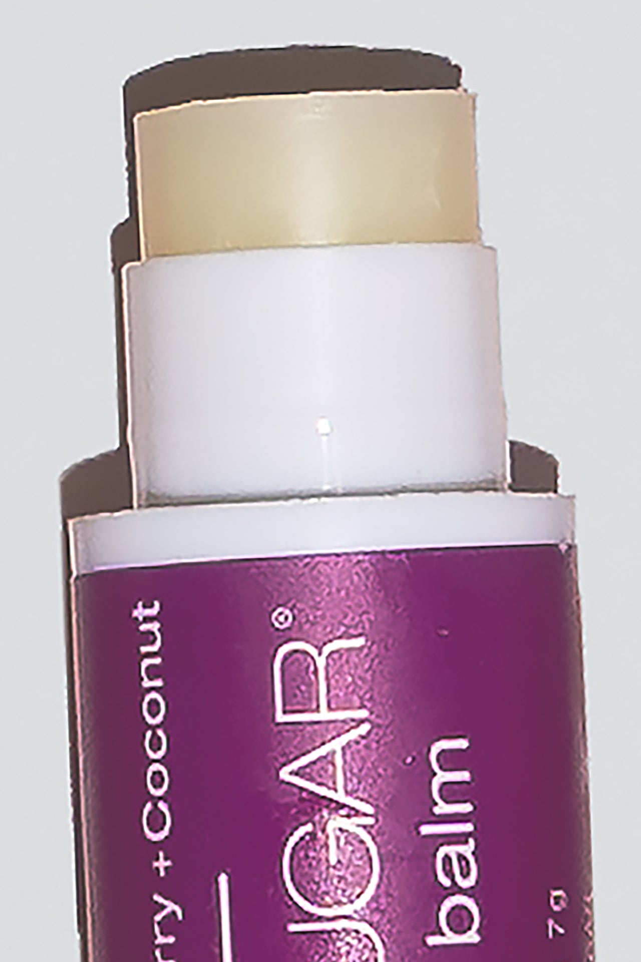  Close up of open lip balm rolled out and ready to use