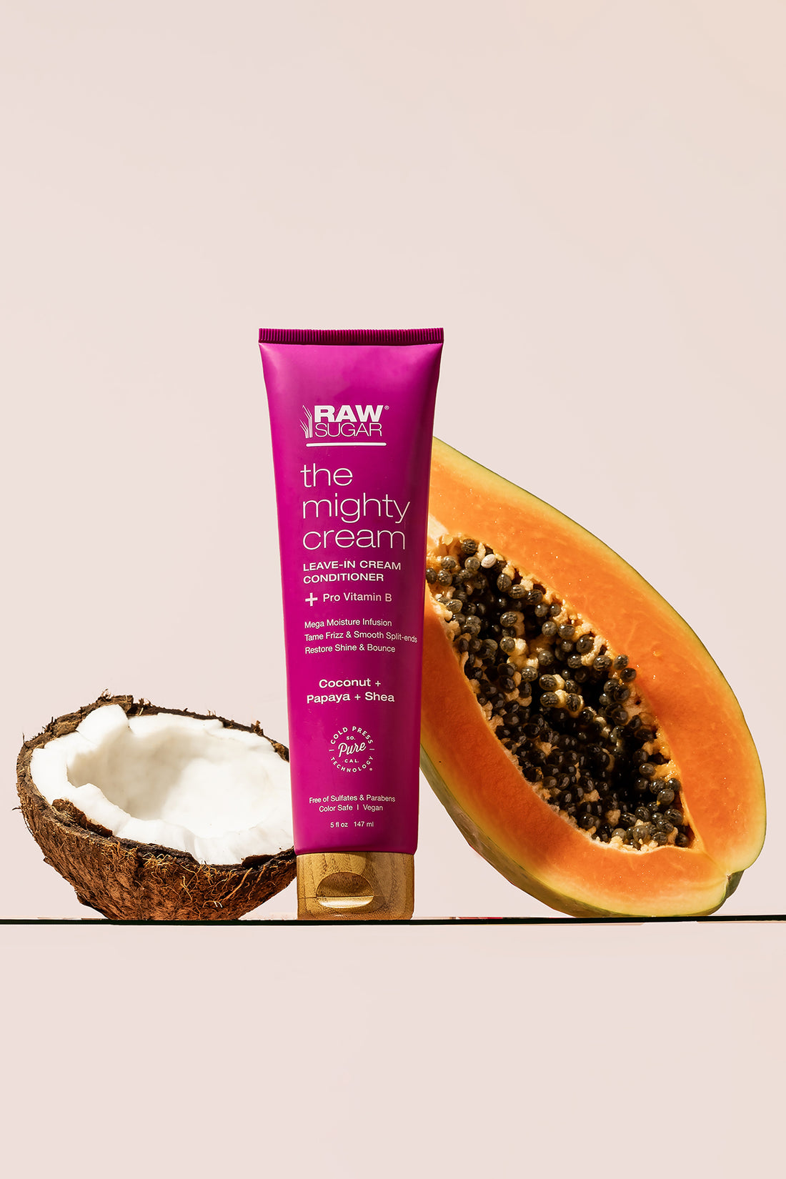 Might Hair Cream with Raw Coconut half and a fresh Papaya half