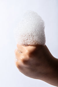 Hand holding suds