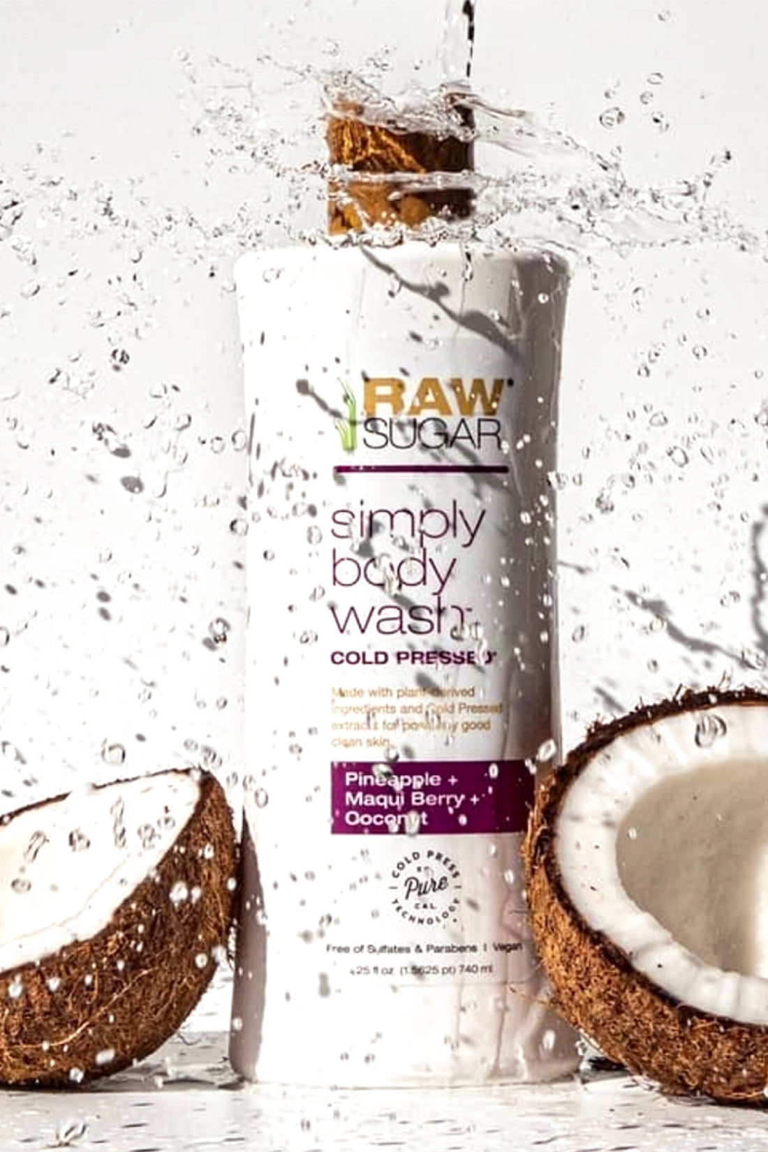Raw Sugar Body Wash with 2 raw coconuts with water pouring on it