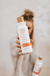 Woman Holding Mango Shampoo