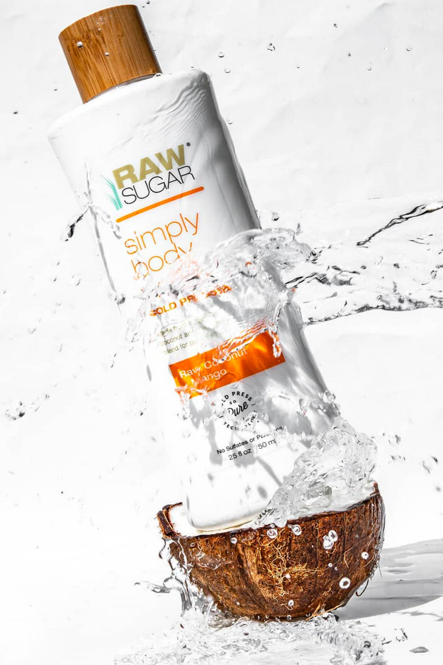 Raw Sugar Body Wash on top of a raw coconut with water pouring on it