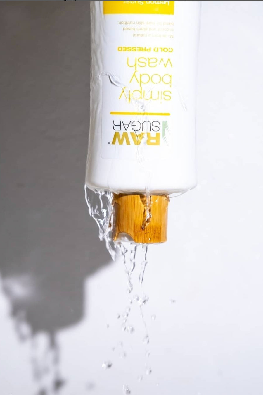 Upside down body wash with water falling