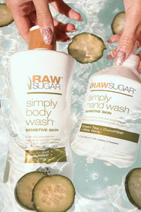 hand holding body wash and hand wash under water