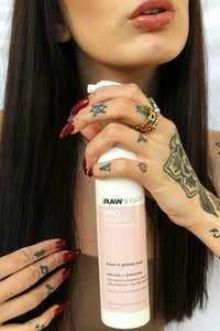 Image of woman holding Pro Remedy Primer Mist Close to Face