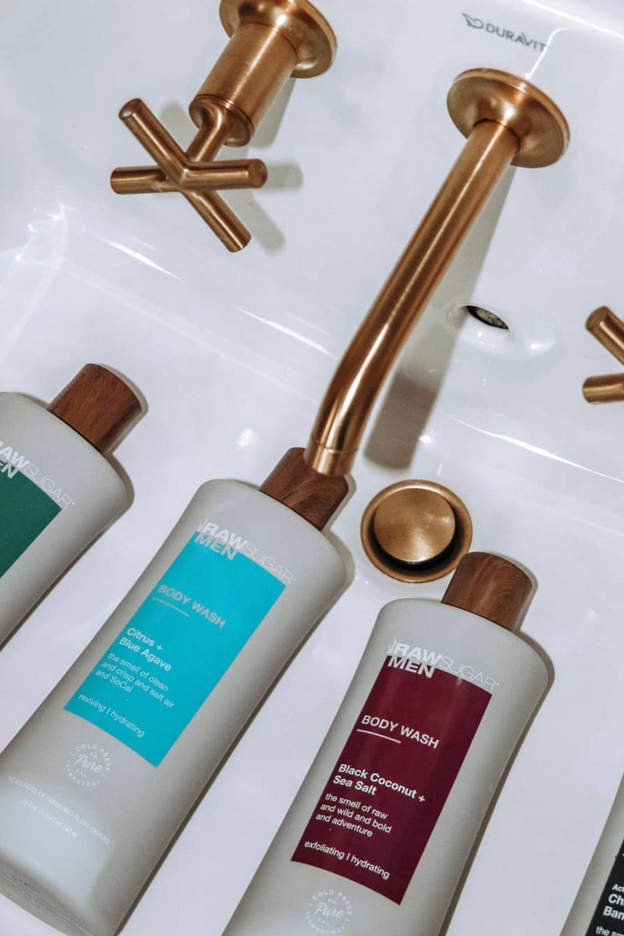 flat lay of body washes in sink