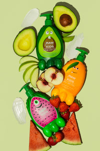 Three Kids Lotions on Green Background with Various Fruits