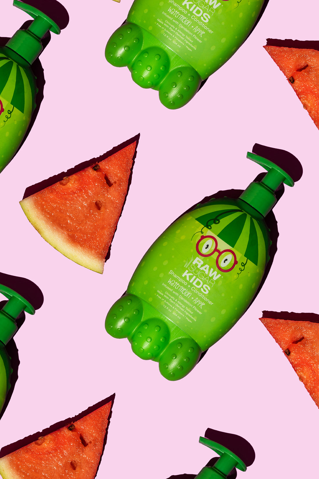 Raw Sugar Kids Watermelon + Apple Conditioner Monster bottles lying flat amount fresh watermelon triangle slices